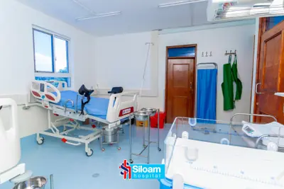 Inpatient ward at Siloam Hospital with a hospital bed and infant incubator